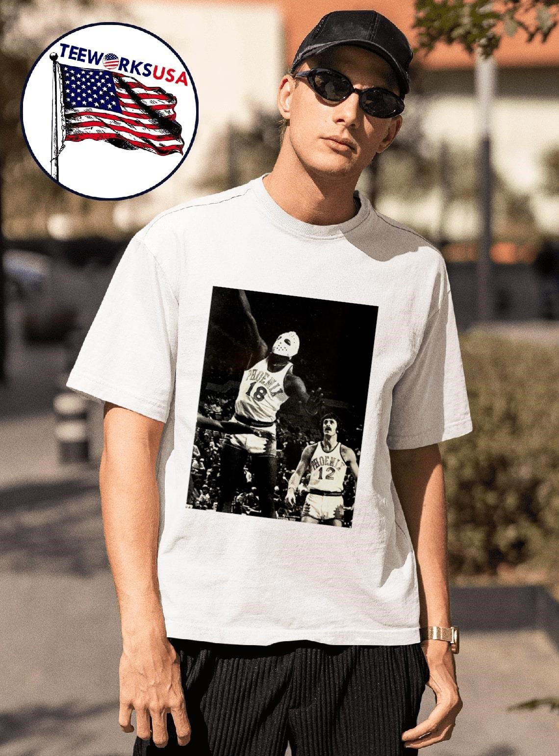 phoenix-suns-curtis-perry-18-wearing-a-hockey-mask-and-pat-riley-trailing-photo-unisex-t-shirt-1 Phoenix Suns Curtis Perry 18 wearing a hockey mask and Pat Riley trailing photo shirt