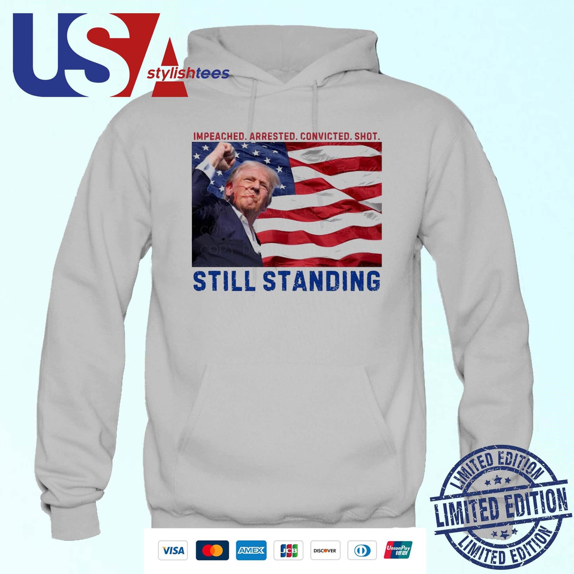 still-standing-trump-impeached-arrested-convicted-shot-hoodie Resilient Trump: Impeached Detained Judged Attacked Hoodie