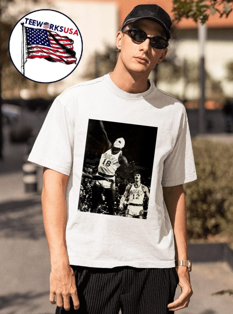 Phoenix Suns Curtis Perry 18 wearing a hockey mask and Pat Riley trailing photo shirt