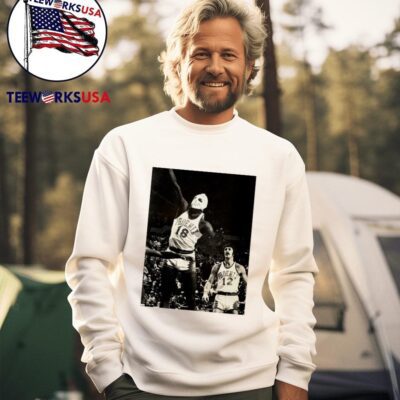 Phoenix Suns Curtis Perry 18 wearing a hockey mask and Pat Riley trailing photo sweater